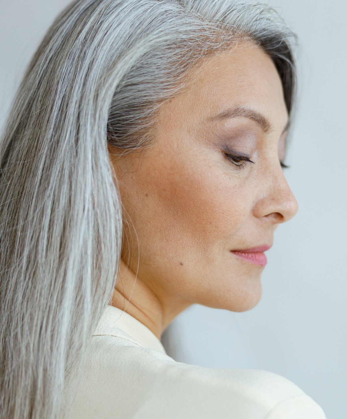 Toronto plastic surgery model with white hair